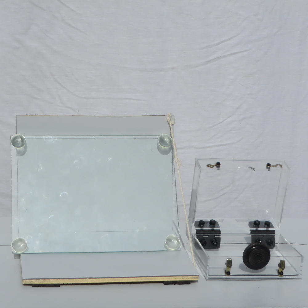 Hinged glass boxes for taking photos of undersides on
